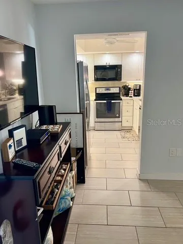 a kitchen with a stove and a microwave