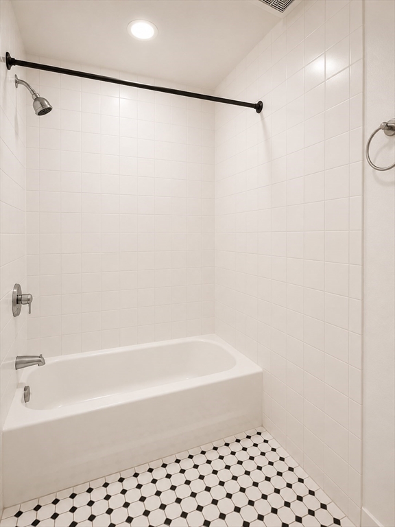 746 Broadway, Unit 2 Chelsea, MA 02150 - Photo 11 of 13 a bathroom with a bathtub and a shower