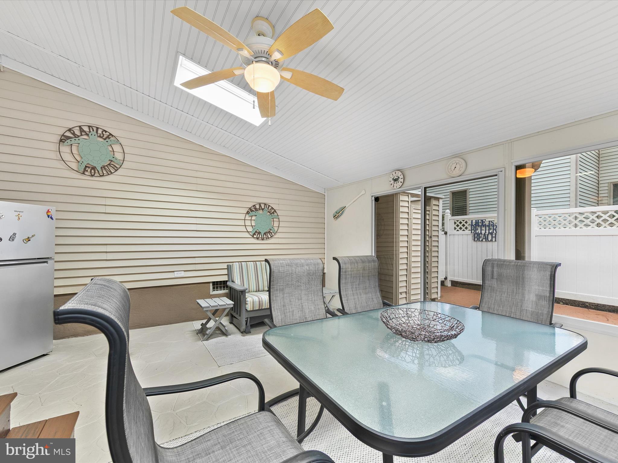 982 Turtle Drive Bethany Beach, DE 19930 - Photo 19 of 73 a view of a dining room with furniture and wooden floor
