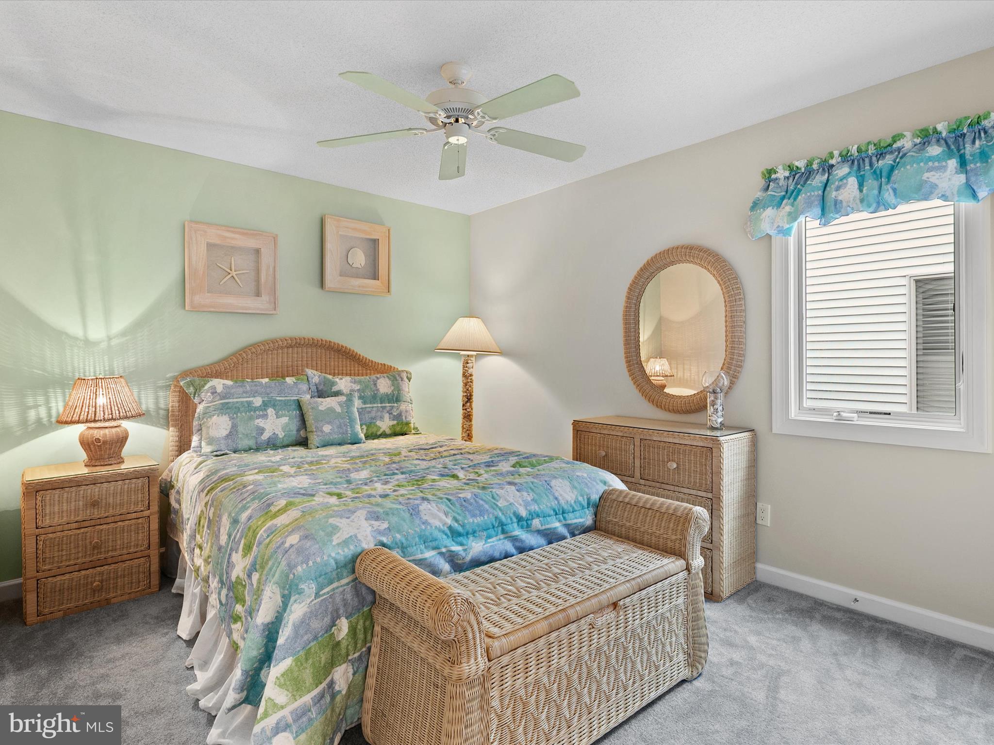 982 Turtle Drive Bethany Beach, DE 19930 - Photo 22 of 73 a bedroom with a large bed and a chandelier