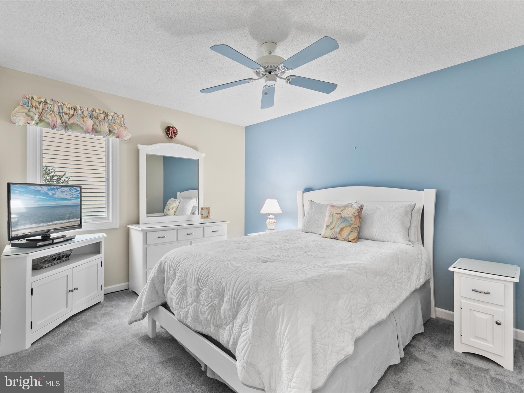 982 Turtle Drive Bethany Beach, DE 19930 - Photo 24 of 73 a bedroom with a bed and a flat screen tv