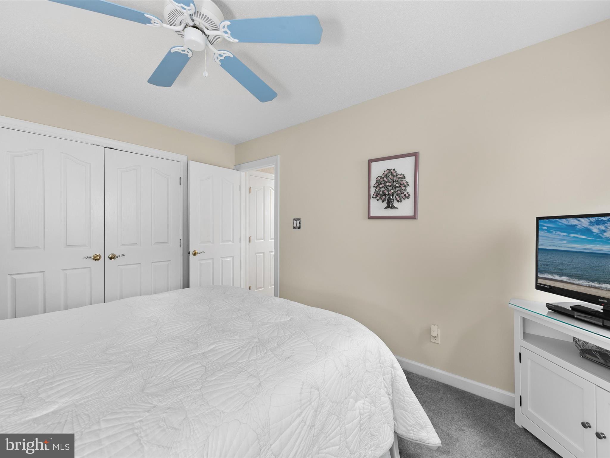982 Turtle Drive Bethany Beach, DE 19930 - Photo 25 of 73 a bedroom with a bed and a flat tv screen on dresser