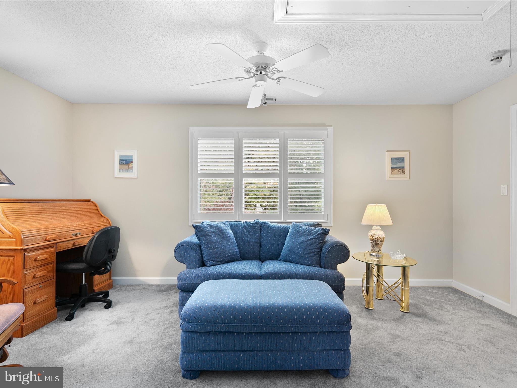 982 Turtle Drive Bethany Beach, DE 19930 - Photo 31 of 73 a living room with furniture a ceiling fan and a window