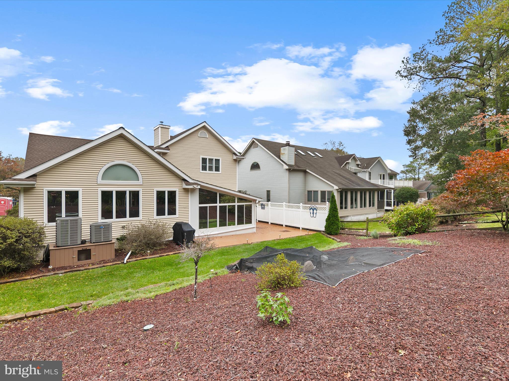 982 Turtle Drive Bethany Beach, DE 19930 - Photo 38 of 73 a front view of a house with a garden and trees