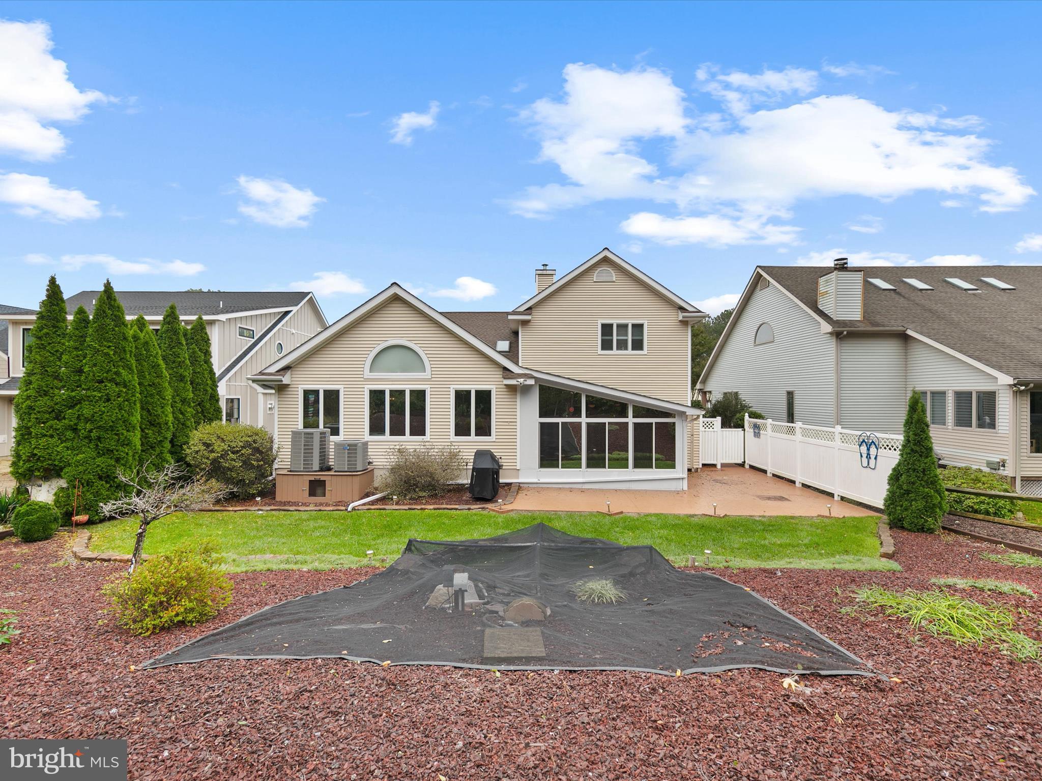 982 Turtle Drive Bethany Beach, DE 19930 - Photo 39 of 73 a front view of a house with a yard and garage