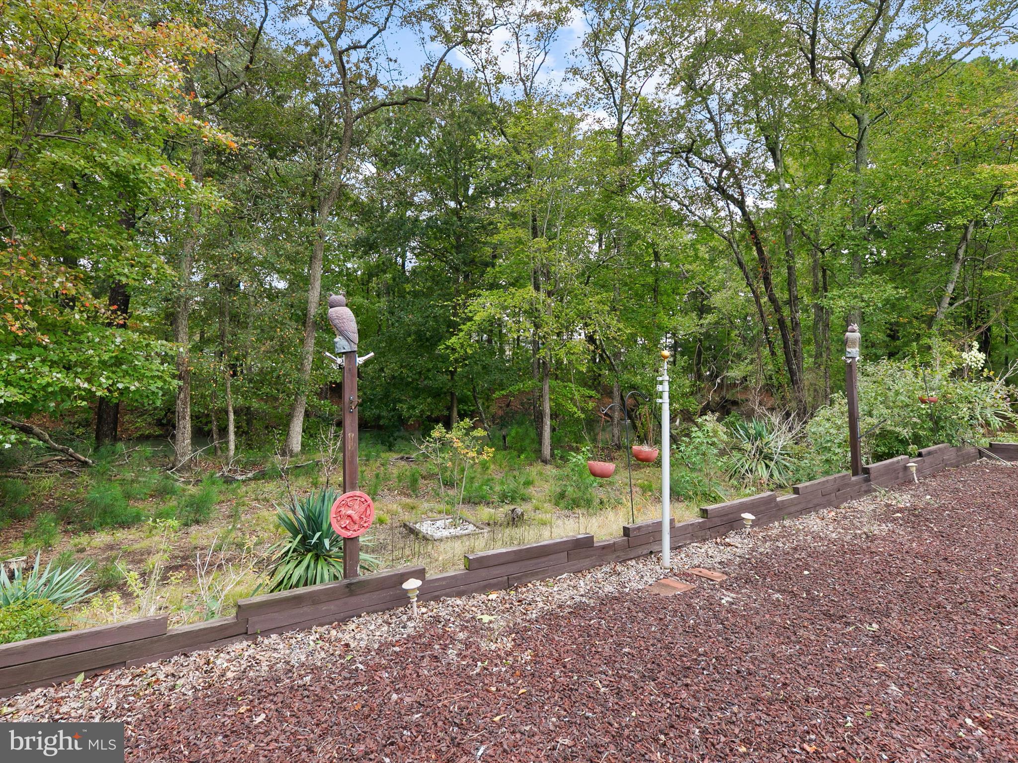 982 Turtle Drive Bethany Beach, DE 19930 - Photo 43 of 73 a backyard of a house with lots of green space
