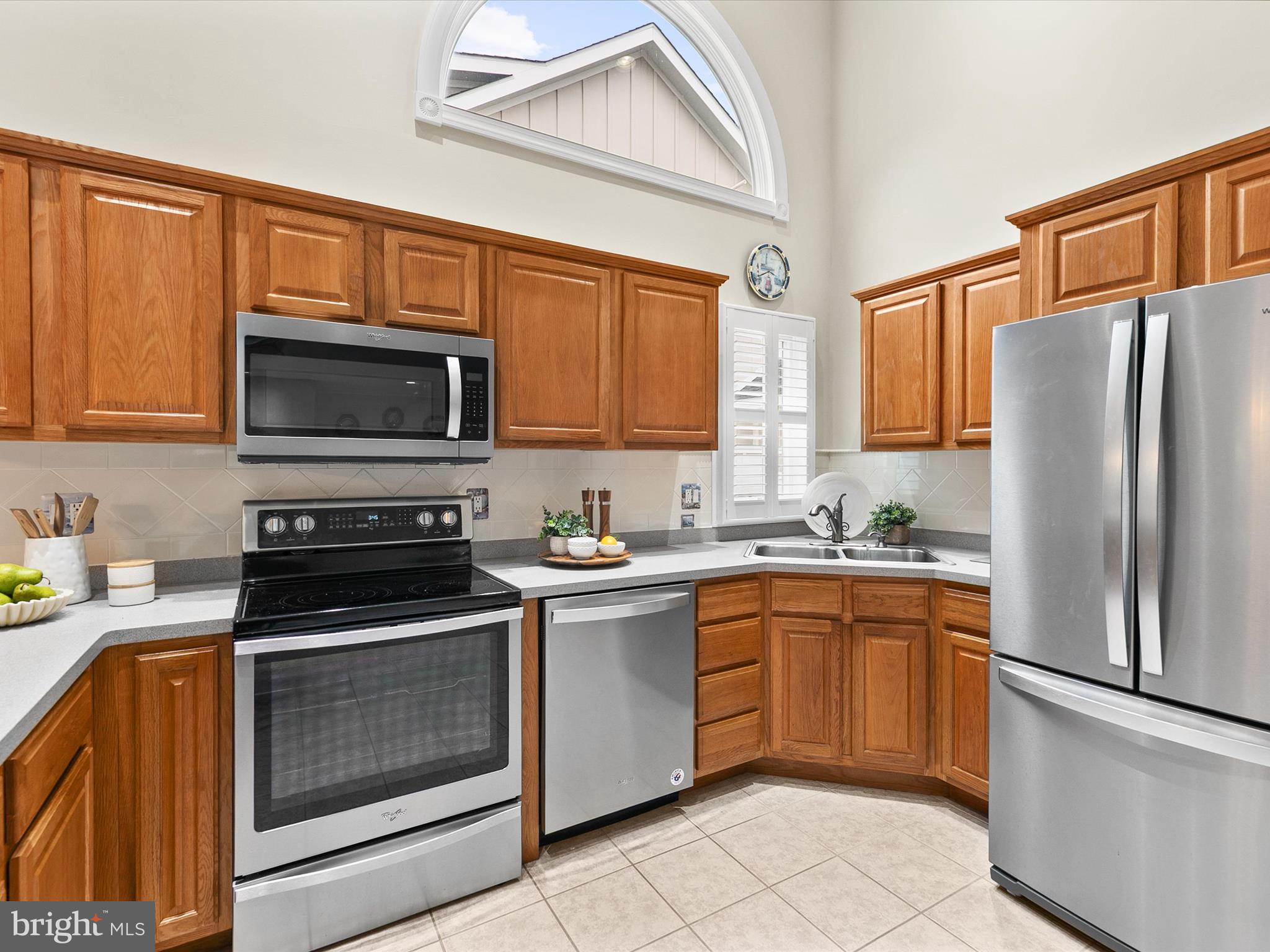 982 Turtle Drive Bethany Beach, DE 19930 - Photo 6 of 73 a kitchen with stainless steel appliances granite countertop a stove top oven a refrigerator and a sink