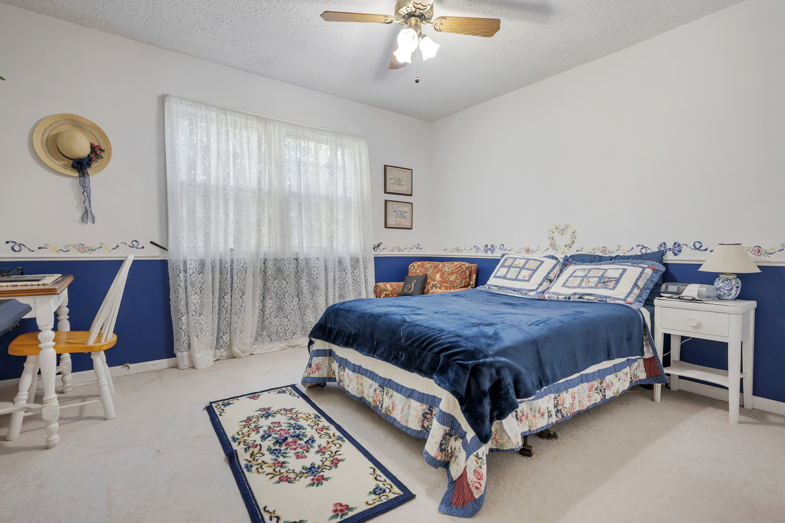 16200 Green Road Harvard, IL 60033 - Photo 18 of 30 a bedroom with a bed and a chandelier