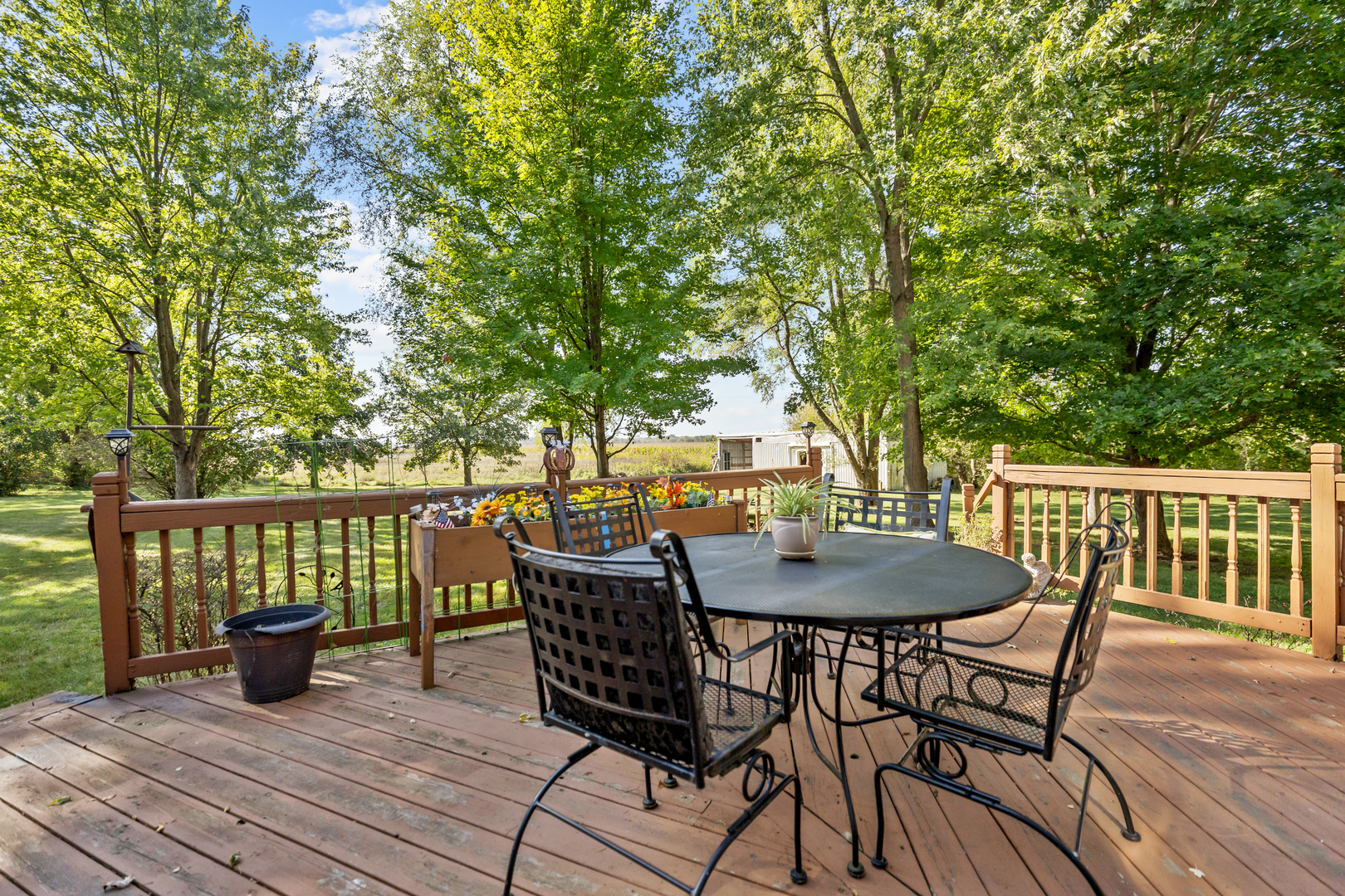 16200 Green Road Harvard, IL 60033 - Photo 24 of 30 a view of a table and chairs on the roof deck