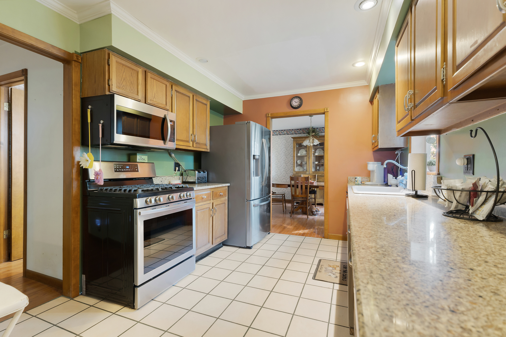 16200 Green Road Harvard, IL 60033 - Photo 8 of 30 a kitchen with stainless steel appliances granite countertop a stove a sink and a microwave