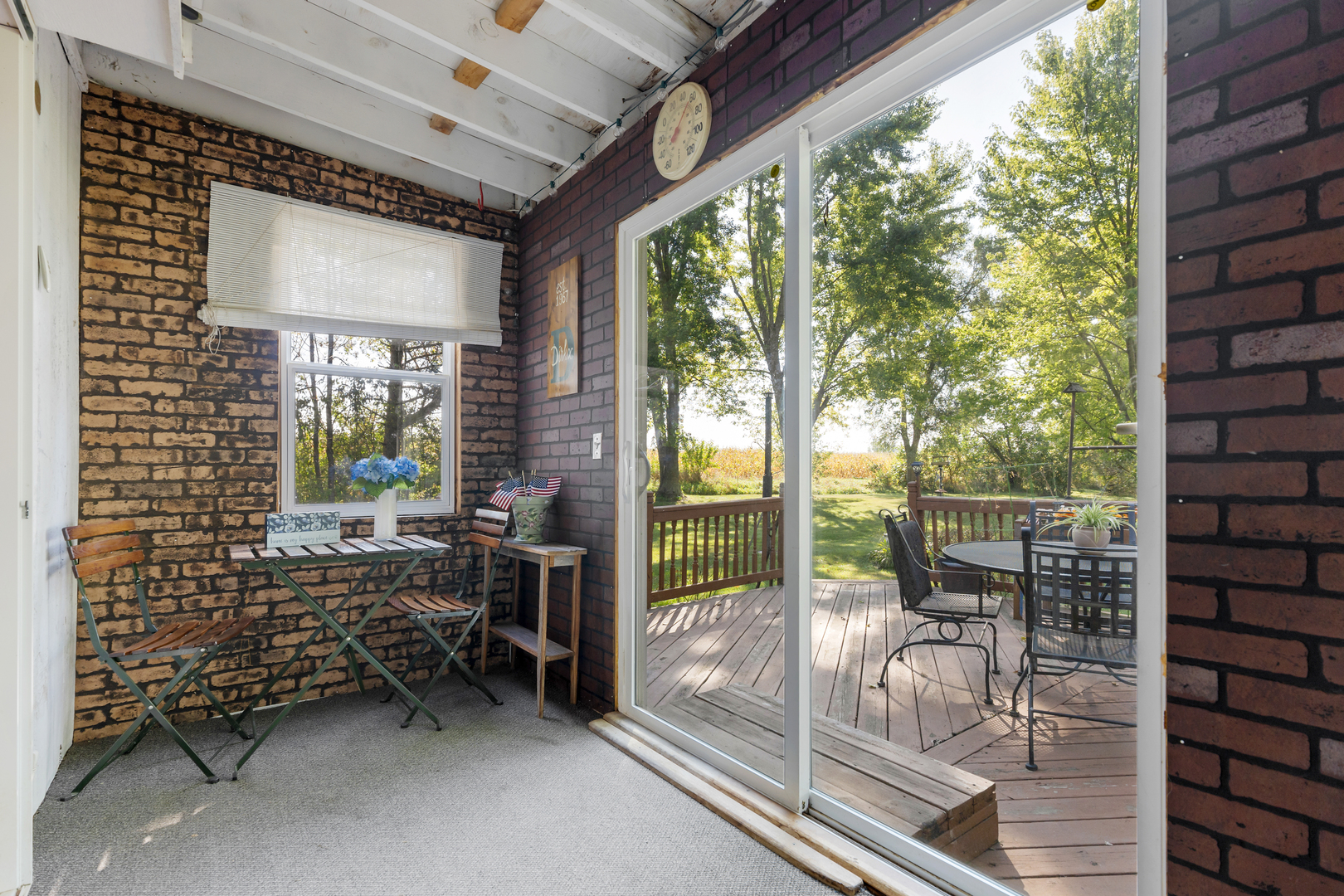16200 Green Road Harvard, IL 60033 - Photo 10 of 30 a view of a porch with chairs and backyard of the house