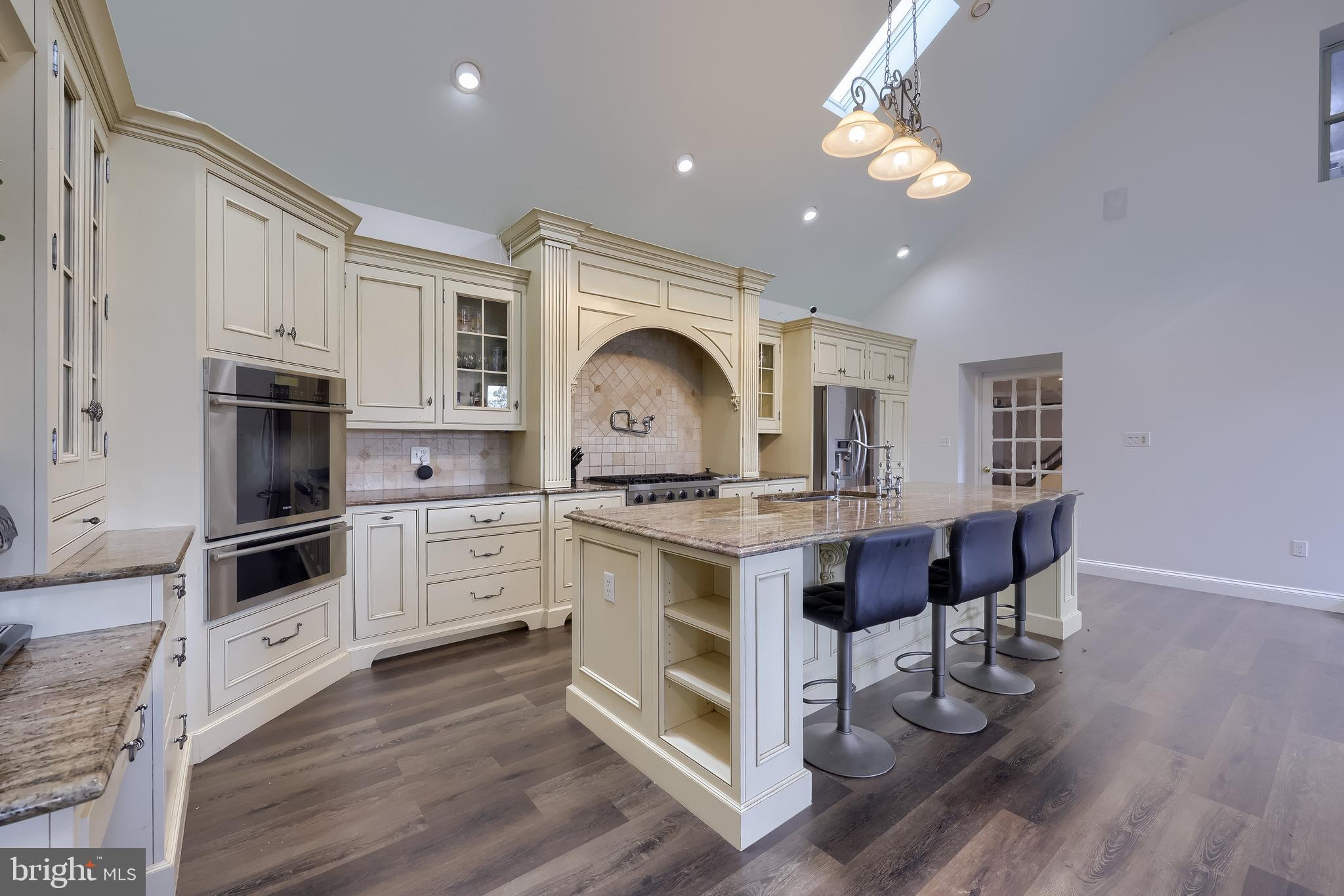 837 Centerville Road Lancaster, PA 17601 - Photo 16 of 91 a kitchen with stainless steel appliances granite countertop a stove a sink dishwasher and a refrigerator with wooden floor