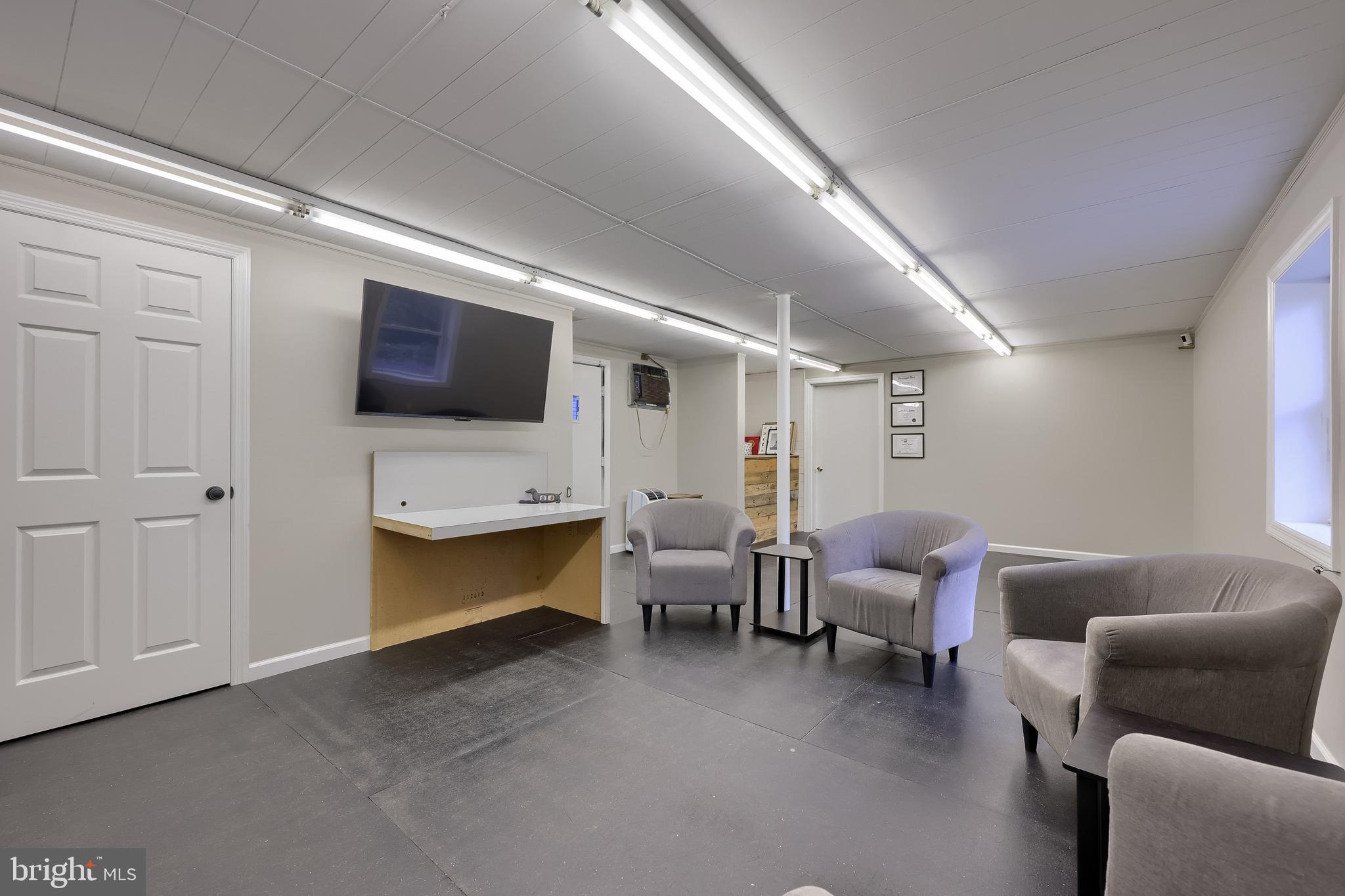 837 Centerville Road Lancaster, PA 17601 - Photo 50 of 91 a living room with furniture and a flat screen tv