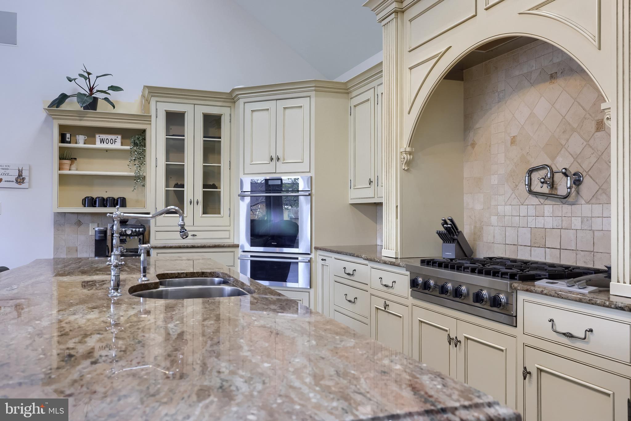 837 Centerville Road Lancaster, PA 17601 - Photo 6 of 91 a kitchen with granite countertop a stove a sink and a refrigerator