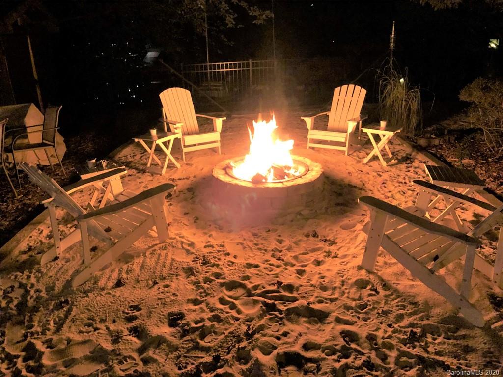 3472 Lake Shore Road South Denver, NC 28037 - Photo 9 of 31 a view of a wooden chairs and fire pit