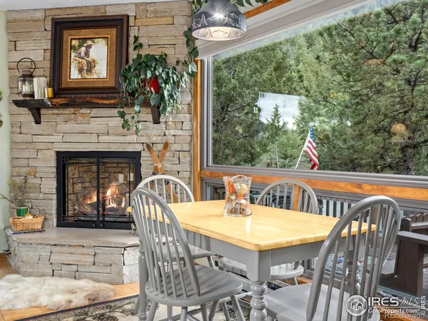 a view of a dining room with furniture window and outside view