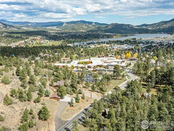 a view of a chairs and table on the wooden floor