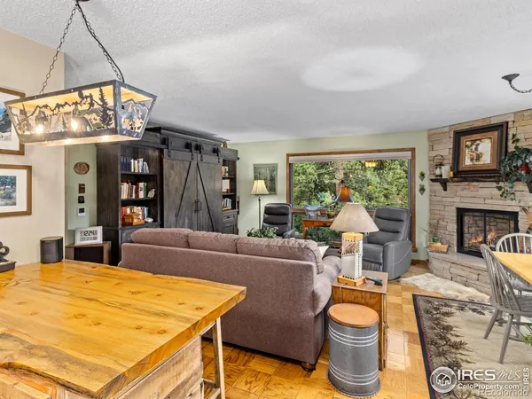 a living room with fireplace furniture and a flat screen tv