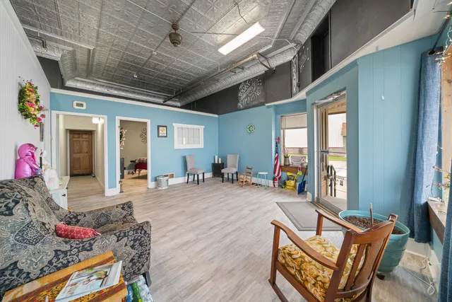 a bedroom with furniture and a dresser