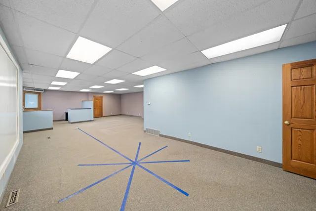 a kitchen with a stove and large window