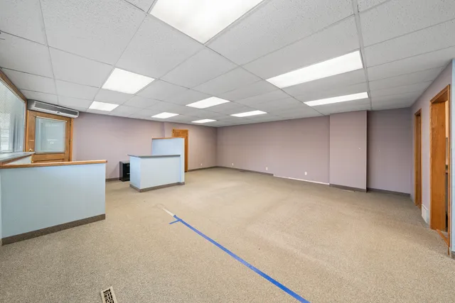 a big room with closet and windows