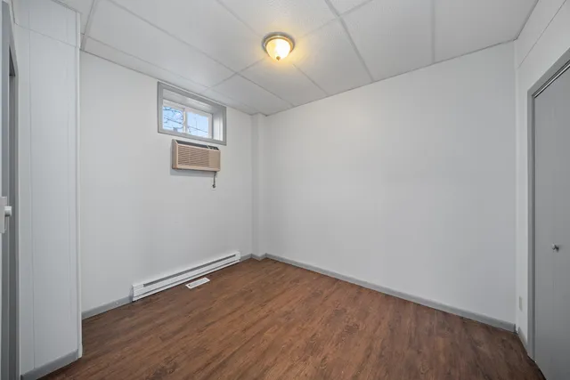 a view of cabinets and wooden floor