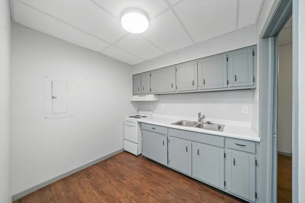 a white toilet sitting next to a bathroom sink
