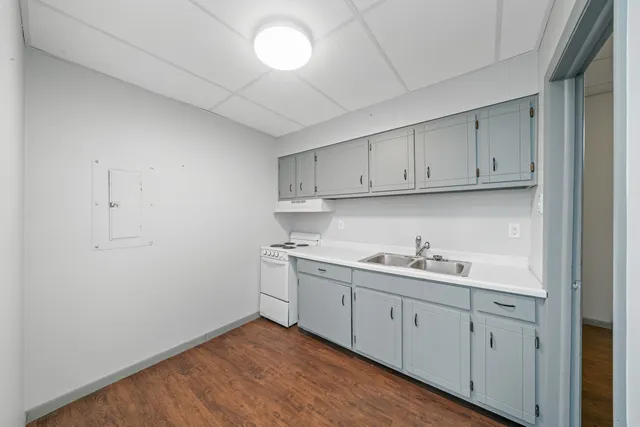 a white toilet sitting next to a bathroom sink