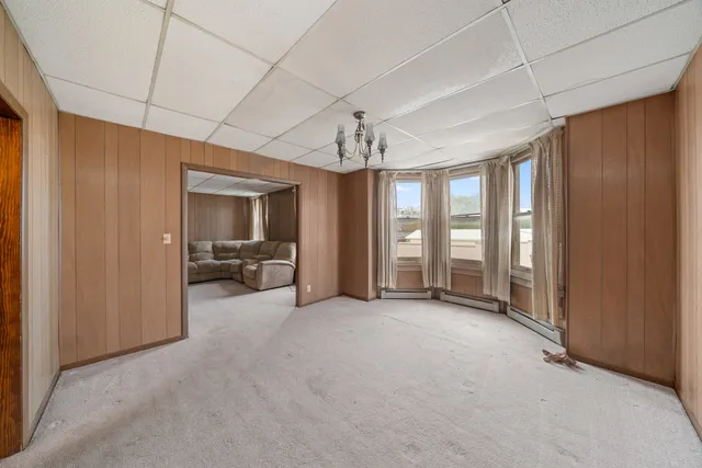 a kitchen with a refrigerator and a stove top oven