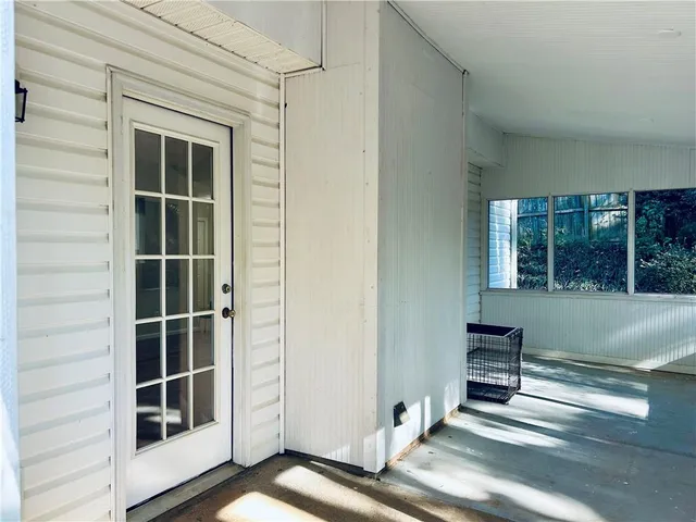 a view of front door and bedroom