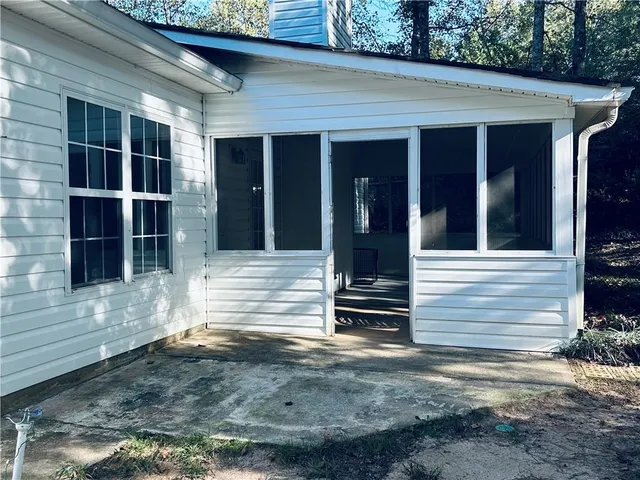 a view of house with door and outdoor space