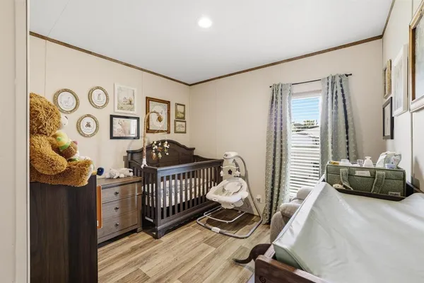 a bedroom with furniture and a window