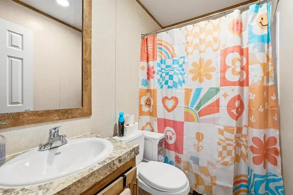 a bathroom with a sink and a toilet