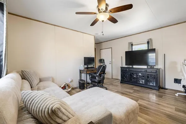 a bedroom with furniture and a flat screen tv
