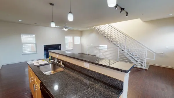 a view of kitchen with furniture and wooden floor