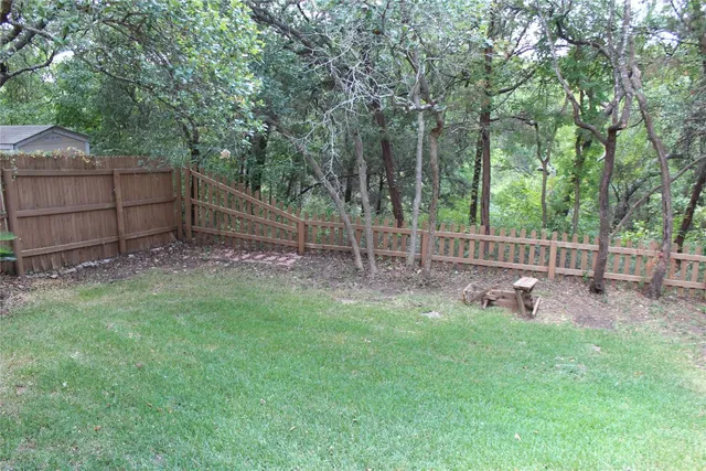 a view of a park with large trees