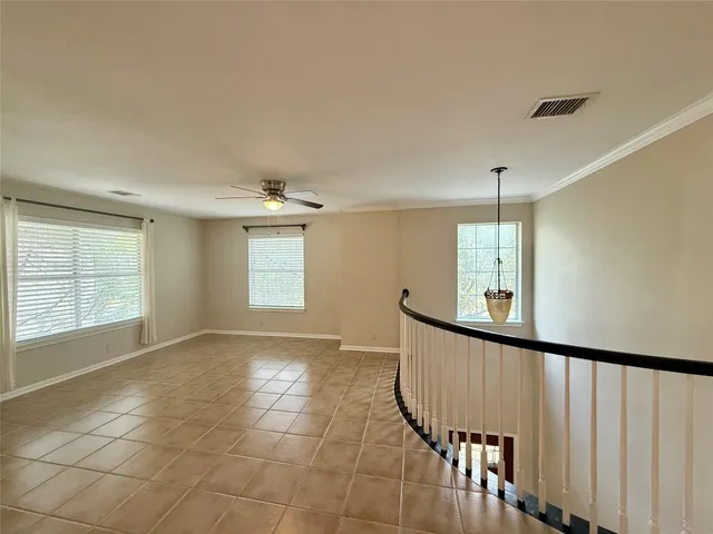 a view of a hallway with windows