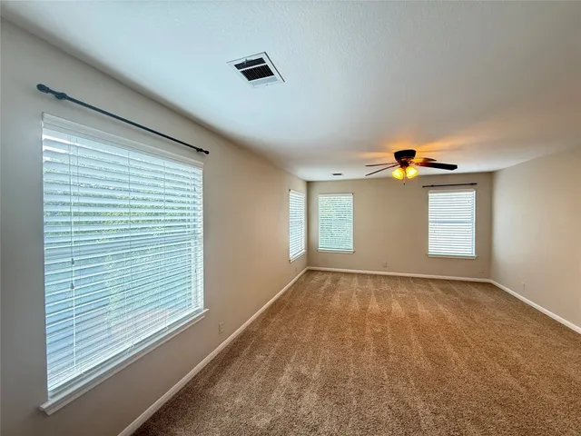 a view of an empty room and window