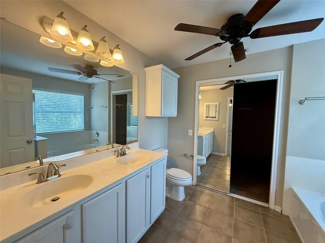 a bathroom with a sink double vanity and a mirror