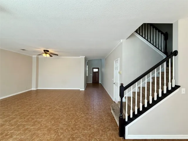 a view of a hallway with staircase
