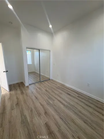 wooden floor and cabinet in an empty room