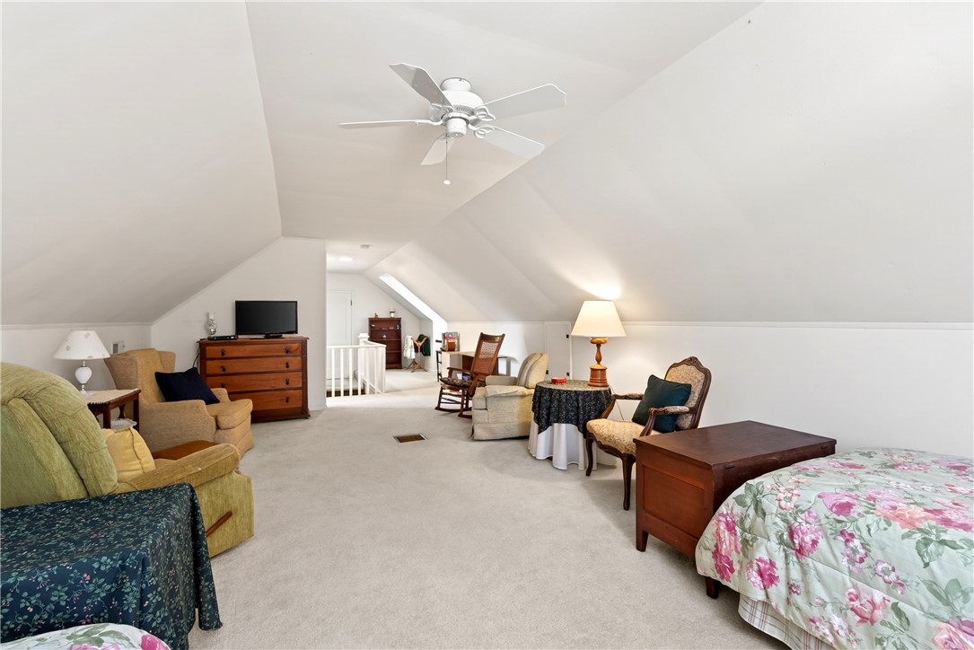 1237 Laurelwood Road Dayton, OH 45409 - Photo 32 of 56 This expansive attic offers versatile living space with sloped ceilings and plush carpeting.