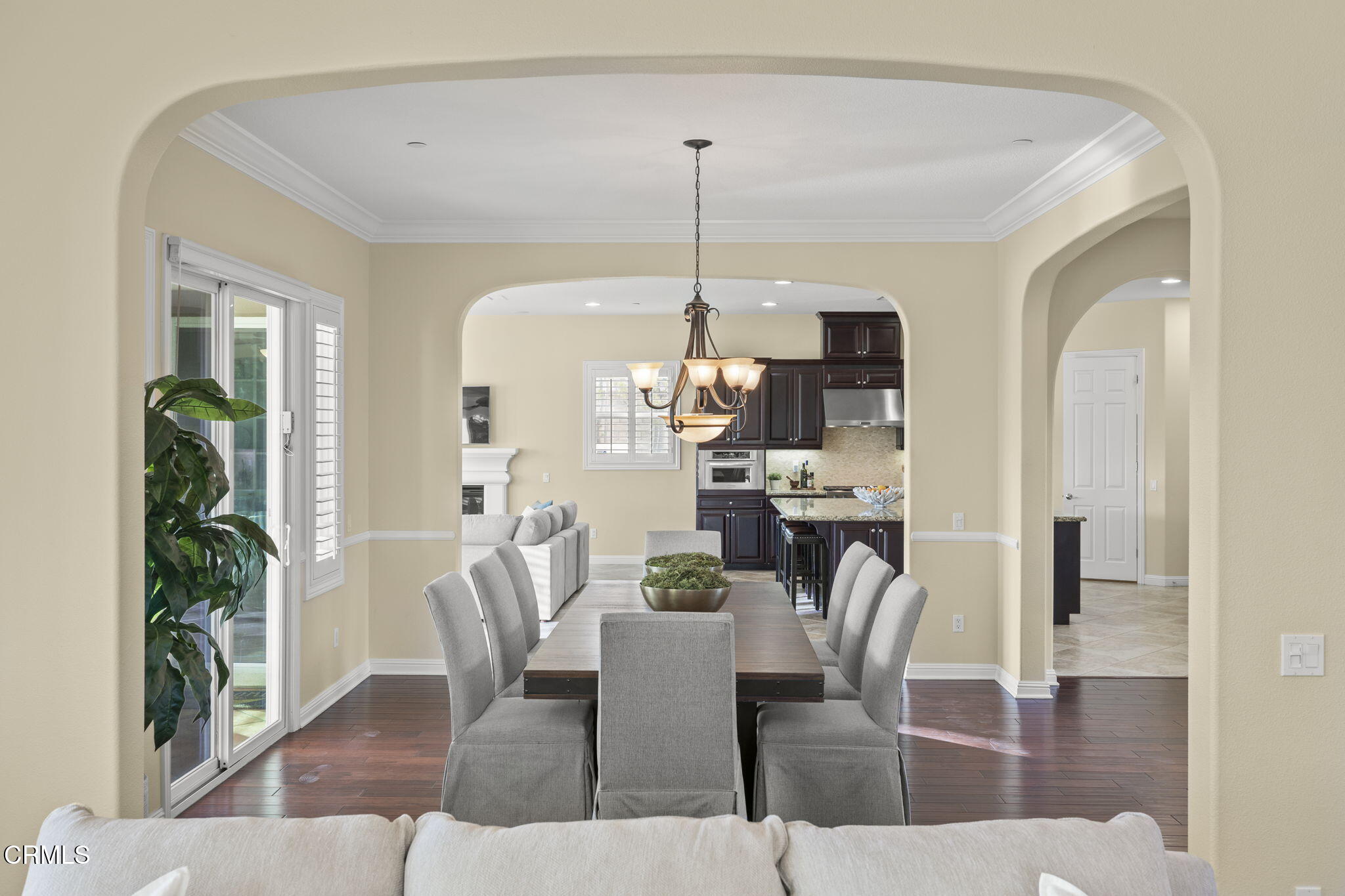 7391 Elk Run Way Moorpark, CA 93021 - Photo 15 of 56 a dining room with furniture potted plants and wooden floor