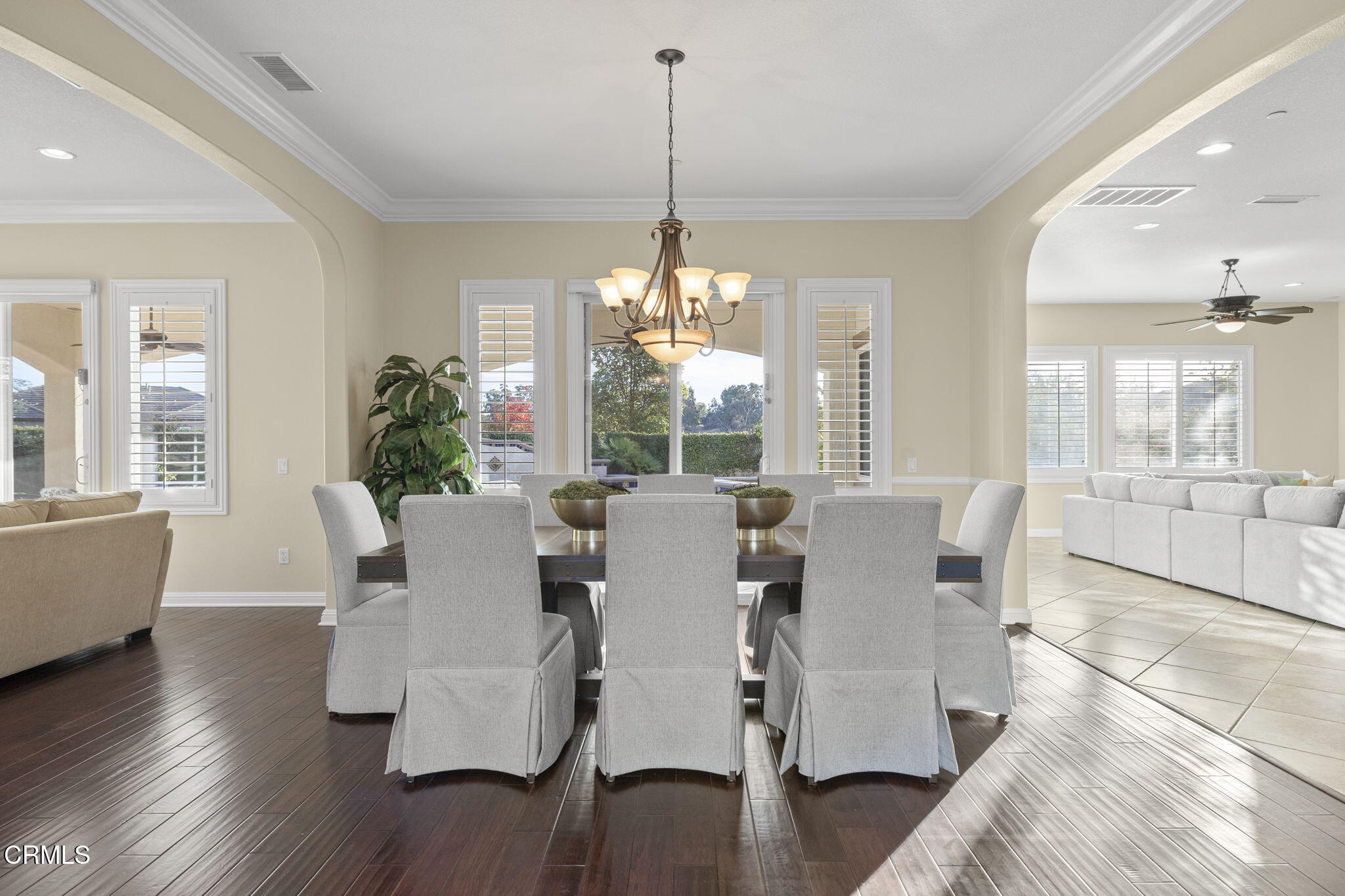 7391 Elk Run Way Moorpark, CA 93021 - Photo 17 of 56 a view of a dining room with furniture wooden floor and a chandelier