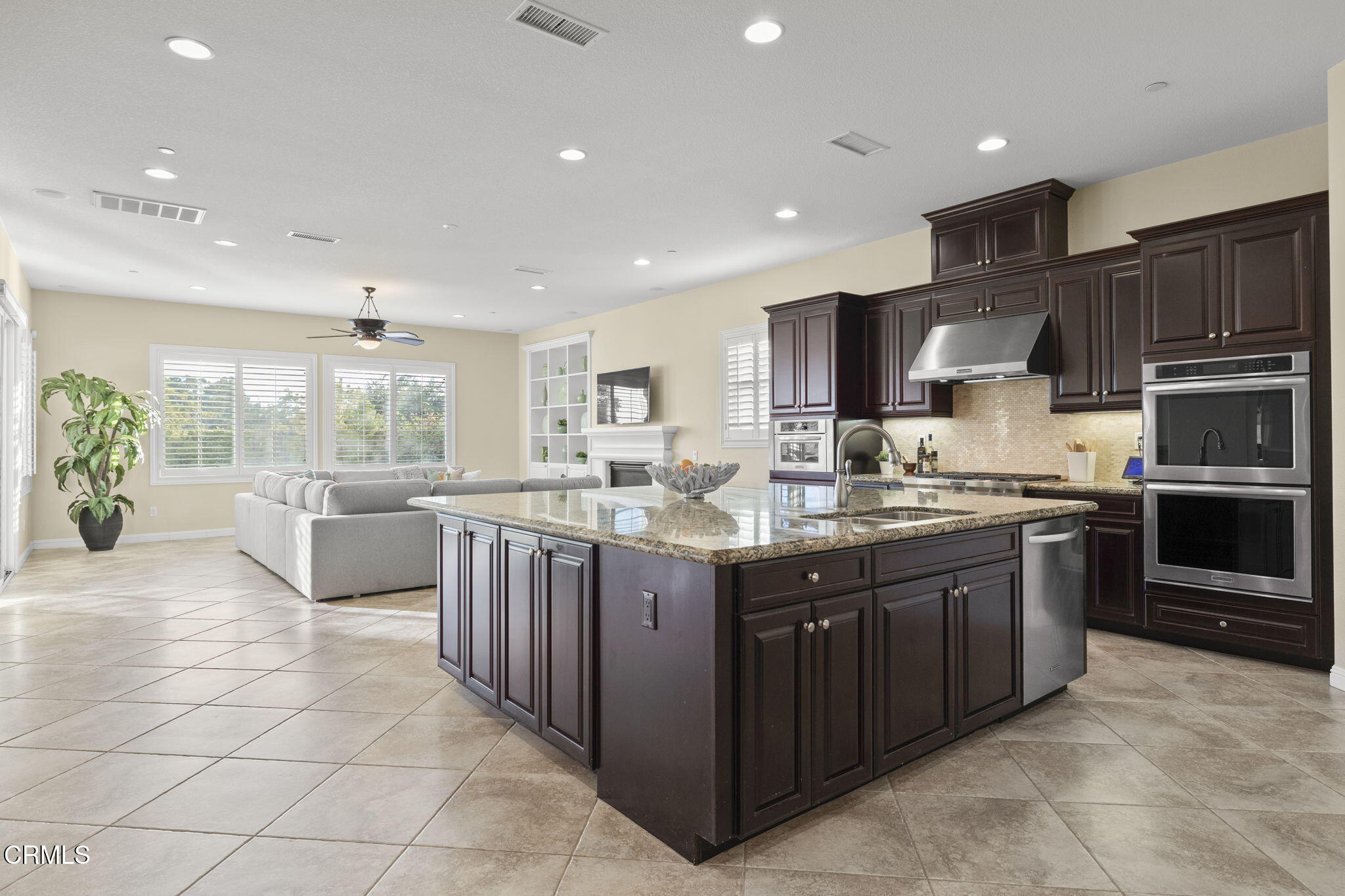 7391 Elk Run Way Moorpark, CA 93021 - Photo 22 of 56 a kitchen with stainless steel appliances granite countertop a sink counter space cabinets and a large window