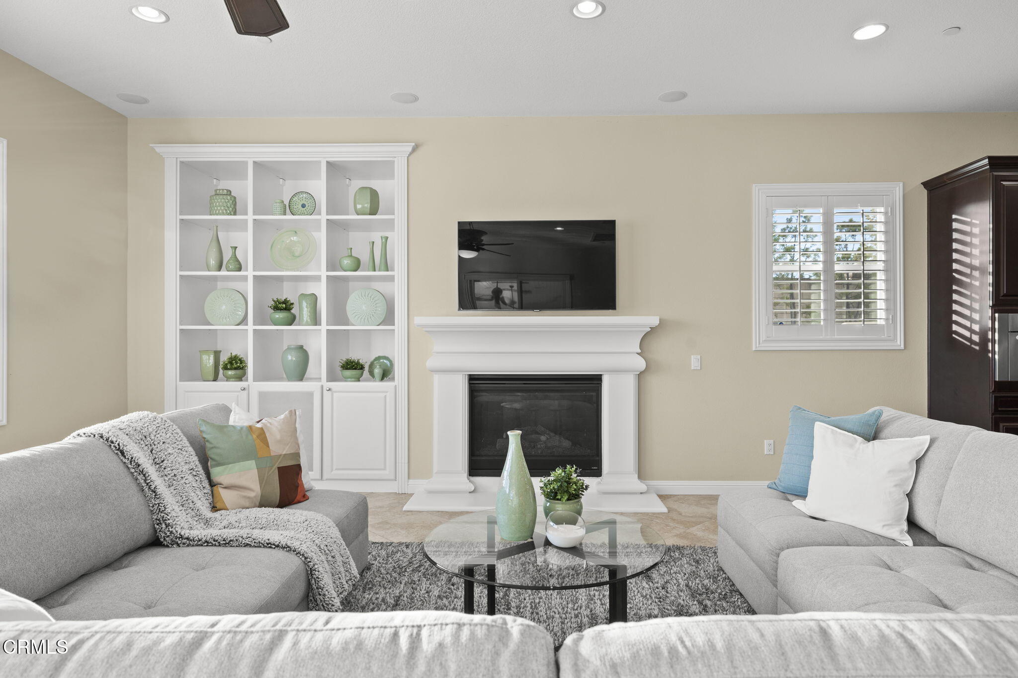 7391 Elk Run Way Moorpark, CA 93021 - Photo 23 of 56 a living room with furniture a flat screen tv and a fireplace