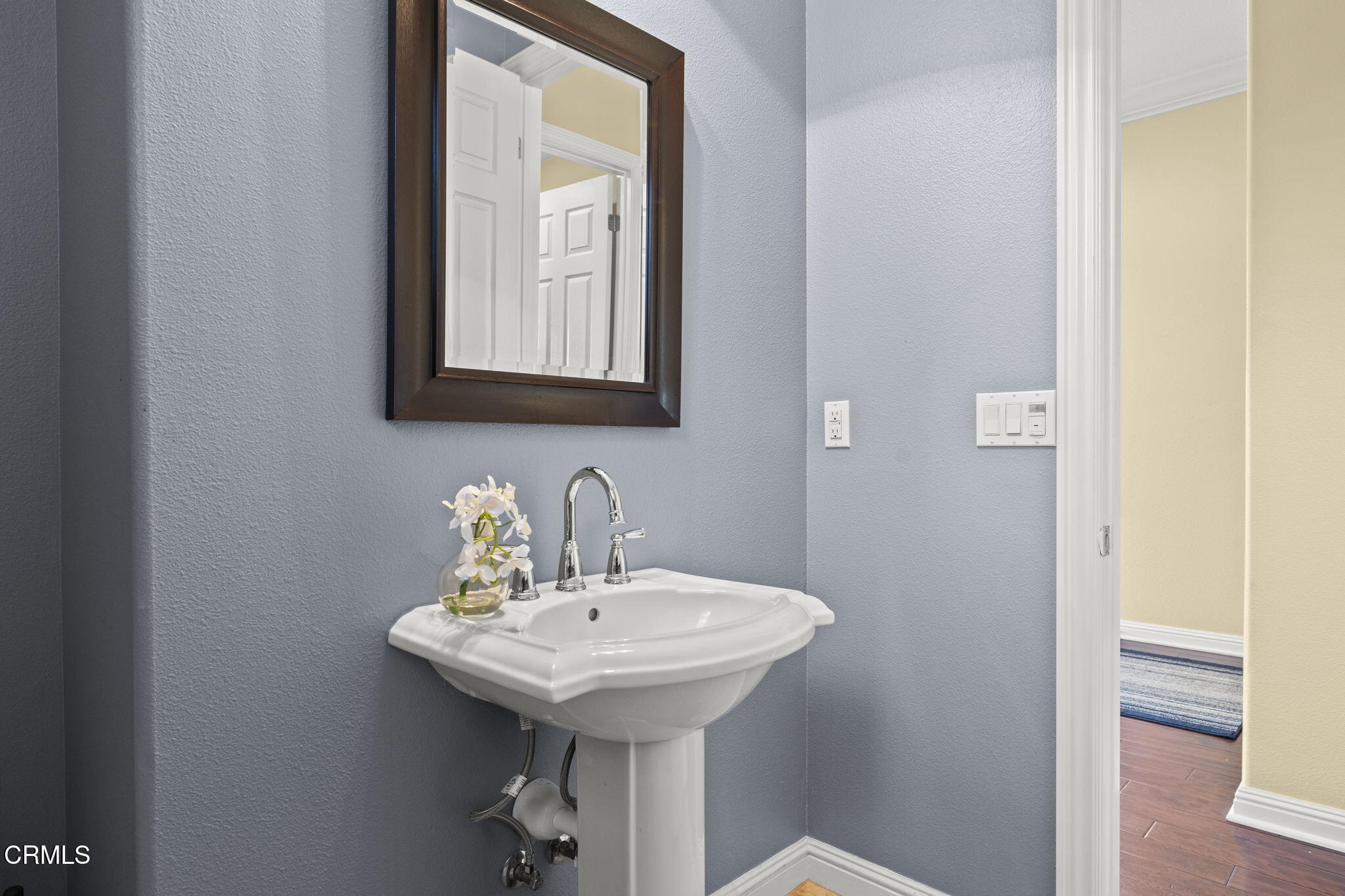 7391 Elk Run Way Moorpark, CA 93021 - Photo 27 of 56 a bathroom with a sink a mirror and vanity