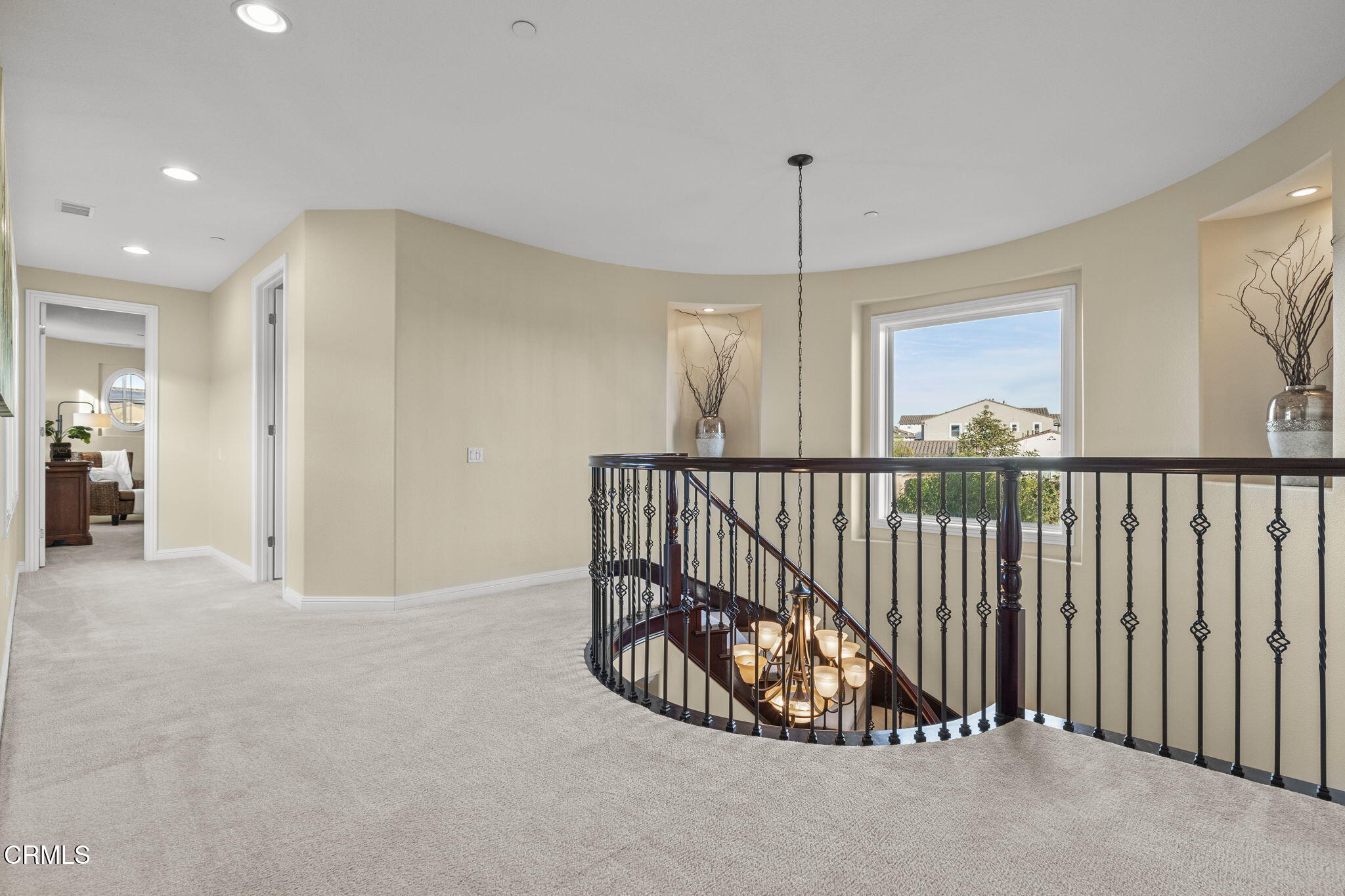 7391 Elk Run Way Moorpark, CA 93021 - Photo 29 of 56 a view of a hallway with a chandelier