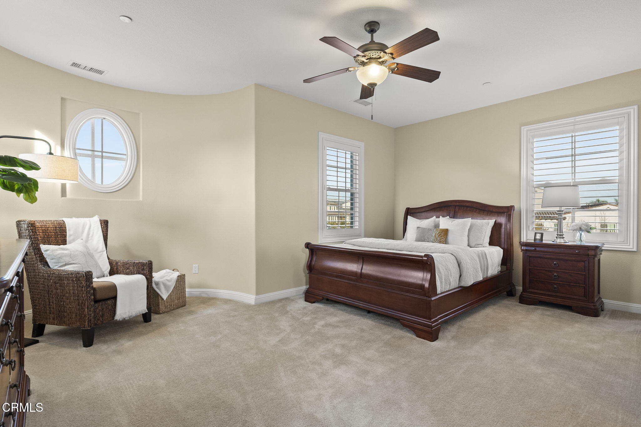 7391 Elk Run Way Moorpark, CA 93021 - Photo 32 of 56 a bedroom with a bed and a chandelier