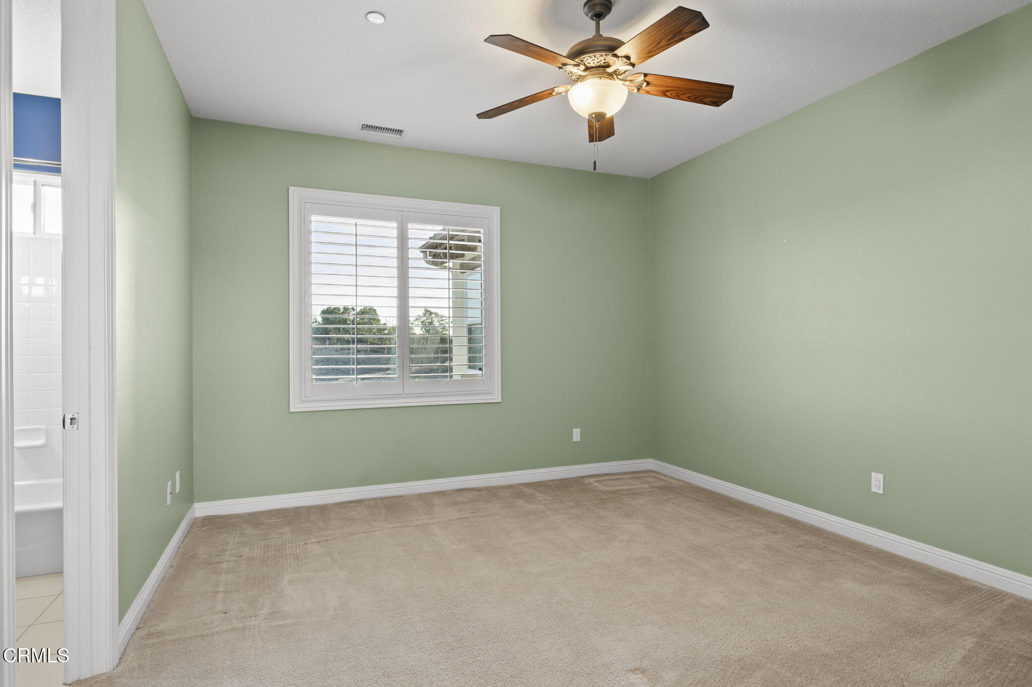 7391 Elk Run Way Moorpark, CA 93021 - Photo 37 of 56 an empty room with a window and a fan